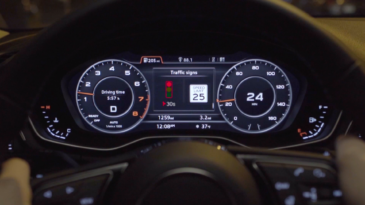 Audi vehicle instrumentation panel that shows stop light signal timing.